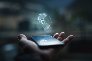 Earth hologram above smartphone screen - obrazy, fototapety, plakaty