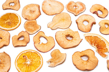 Dried fruit isolated on white background. Dried grapefruit, dried apple, dried pear.