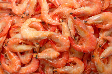 Shrimps background texture. A lot of shrimps. Cooked shrimps.