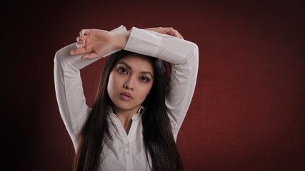 Young asian woman posing for the camera - studio photography