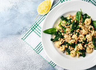 Funghetti pasta with spinach, pine nuts and parmesan.