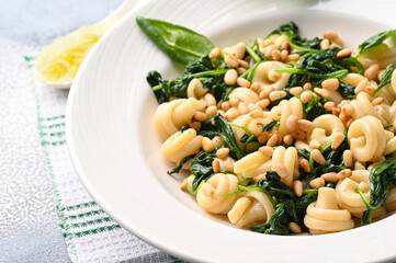 Funghetti pasta with spinach, pine nuts and parmesan.