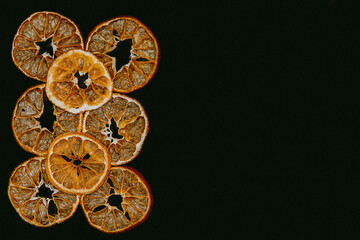 Citrus, oranges and orange slices on a colored background with a place under the text
