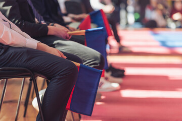 Judges with red and white flags in contact martial arts competitions. Sports lifestyle.