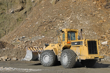 A large bulldozer working on slate mining in Gestoso, León, Spain