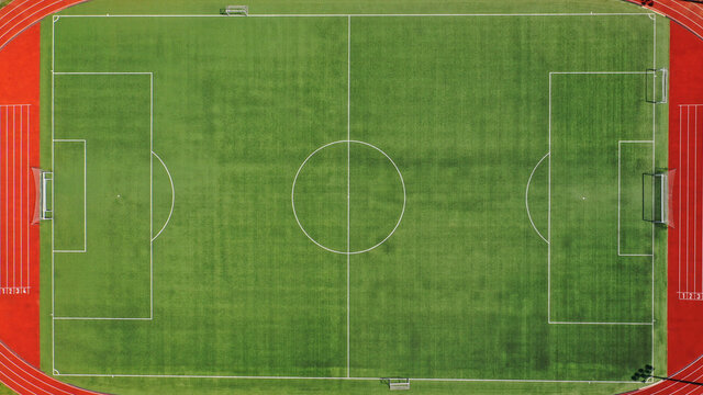 Aerial drone top down photo of beautiful renovated empty football pitch inside a stadium