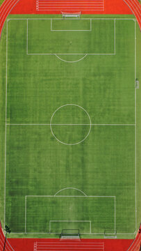 Aerial drone top down photo of beautiful renovated empty football pitch inside a stadium