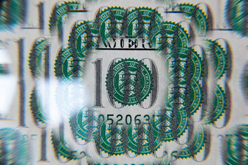 US 100 dollar banknote through kaleidoscope prism