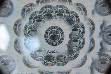 US 100 dollar banknote through kaleidoscope prism