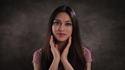 Fototapeta premium Studio portrait of a pretty Asian girl - studio photography