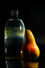 still life old bottle and pear