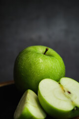 green apple on the black background