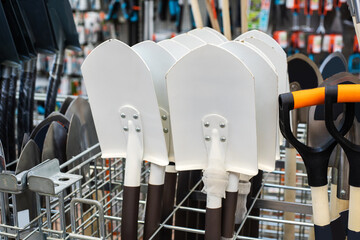 Metal shovels. Sale of garden tools in a shop. Close-up