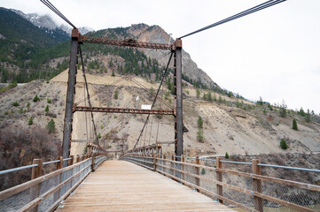 The historic  Old Bridge across the Fraser River at Lillooet British Columbia, Canada.  The bidge was built in 1906 and is now pedestrian only.