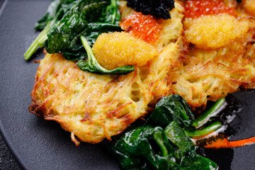 Hash brown potato, vegetable pancakes with caviar