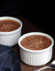 Chocolate vegan dessert - aquafaba mousse - egg free, non-dairy cocoa pudding or souffle on dark moody background, closeup, vegan and vegetarian food concept