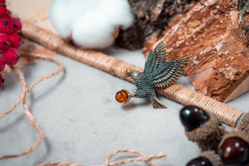 A brooch in the form of an eagle of bronze and amber