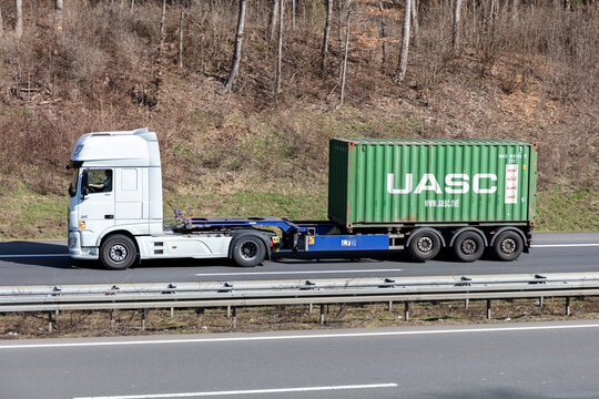 WIEHL, GERMANY - MARCH 24, 2021: DAF XF truck with 20 ft UASC container on motorway.