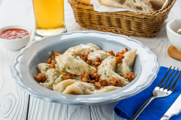 Dumplings with fried onions and beer