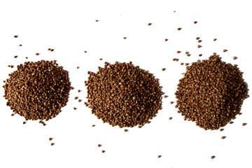Three heap of dry buckwheat groats isolated on white background. Healthy product. Vegetarian food. Top view.