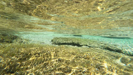 Underwater photo of tropical exotic island sea bed in calm emerald beach