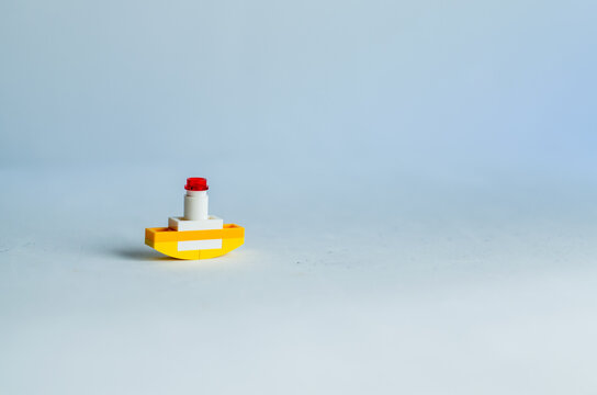 Tiny Little Boat Toy In White Background