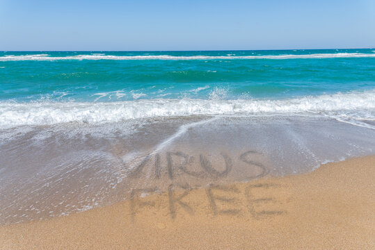 Empty beach and blue sky. Mediterranean summer vacation covid 19 vrus free destination, Heraklion, Crete, Greece.