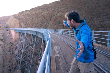 person walking on bridge, Salta Argentina, v
iaducto polvorilla