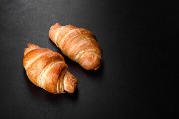 Fresh crisp delicious French croissant with a cup of fragrant coffee