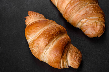 Fresh crisp delicious French croissant with a cup of fragrant coffee