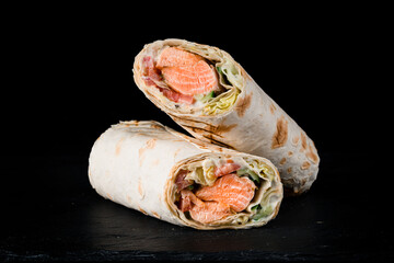 Seafood shawarma. Grilled Cheesy Gyros roll with roasted salmon fish fillet in thin lavash bread....