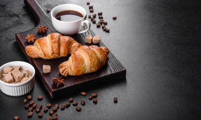 Fresh crisp delicious French croissant with a cup of fragrant coffee