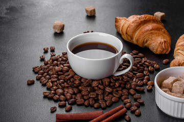 Fresh crisp delicious French croissant with a cup of fragrant coffee