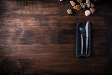 knife and fork on wooden background. Cutlery on wooden.