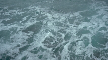 View of the foaming waves of the sea. Turquoise sea