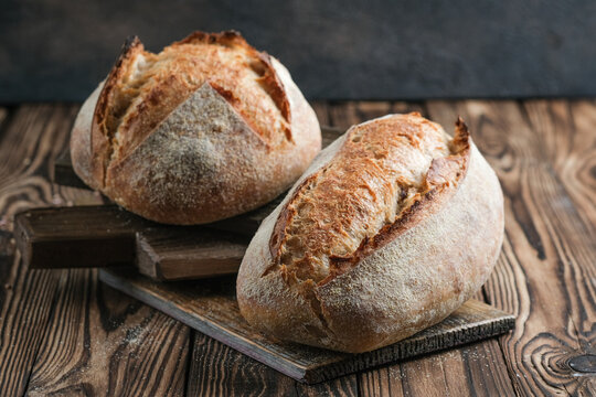 Fresh homemade sourdough bread on a rustic background.
