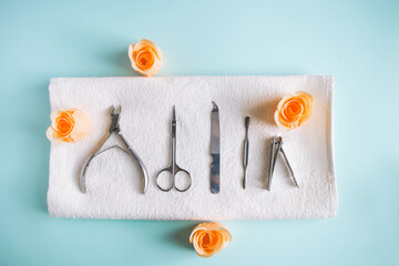 Nail care tools on blue background. Spa accessories for body care.