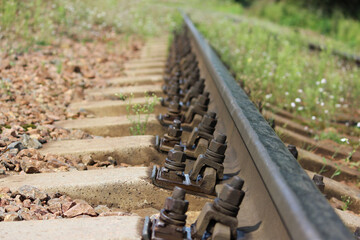 railway, sleepers and rails close-up with a perspective into the distance