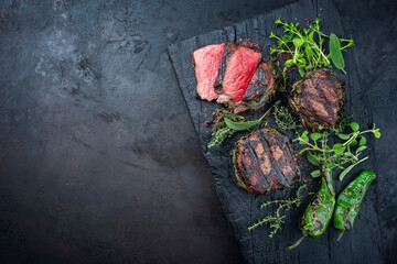 Traditional barbecue dry aged angus medaillon beef filet steak natural with herbs and red wine salt...