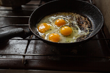 fried eggs in a frying pan