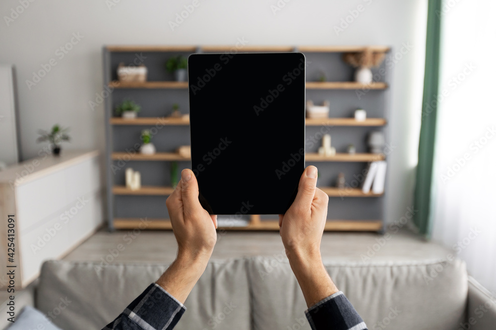 Poster Male Hands Holding Tablet Computer With Empty Screen At Home