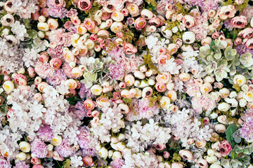 Banner texture bouquet of different petals of flora plants. The flowers of roses, peonies, carnations are very much the sea. Delicious aroma of flowering in spring and summer. Copy space.