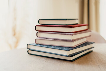Photo album for photos. Color modern books diaries in the office on the table. A notebook for...
