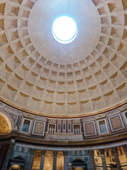 Obraz premium Pantheon oculus in Rome, Italy. Dome open window in roof, interior. Inside famous antique roman temple with a dome hemisphere and colonnade