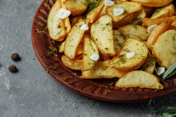 roasted rosemary garlic potato wedges on a plate