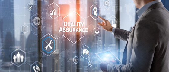 QA Businessman pressing Quality assurance button on virtual screens
