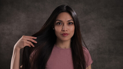 Fototapeta premium Portrait of a pretty Asian woman - studio photography