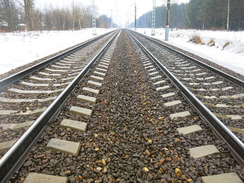 railway tracks go off into the distance in the spring