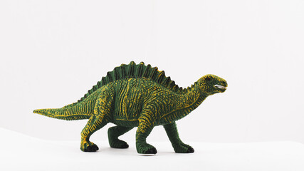 plastic toy dinosaur on white background