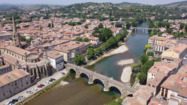 Aerial view of houses of Limoux old town and river Aude at sunny summer day, France